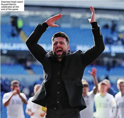  ?? ?? Swansea head coach Russell Martin celebrates at the end of the game