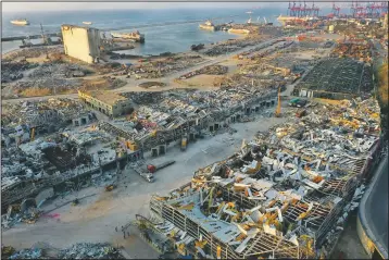  ??  ?? The destroyed port warehouses are seen Aug. 4 at the site of the massive explosion in Beirut.