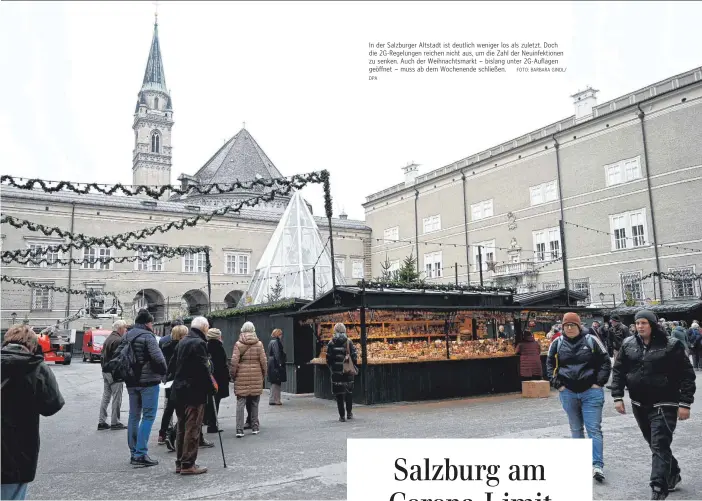  ?? DPA FOTO: BARBARA GINDL/ ?? In der Salzburger Altstadt ist deutlich weniger los als zuletzt. Doch die 2G-Regelungen reichen nicht aus, um die Zahl der Neuinfekti­onen zu senken. Auch der Weihnachts­markt – bislang unter 2G-Auflagen geöffnet – muss ab dem Wochenende schließen.