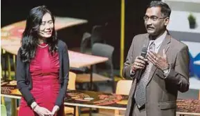  ?? PIC BY MOHD YUSNI ARIFFIN ?? Datuk P. Kamalanath­an giving a speech during a YTL Foundation conference at the Kuala Lumpur Performing Arts Centre in Sentul yesterday, as YTL Foundation programme director Datin Kathleen Chew looks on.