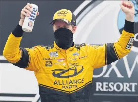  ?? CHARLES KRUPA — THE ASSOCIATED PRESS ?? Rochester Hills native Brad Keselowski celebrates after winning Sunday’s NASCAR Cup Series race at the New Hampshire Motor Speedway. Denny Hamlin finished second.