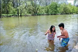  ?? Ckaufman@appealdemo­crat.com ?? Joseph Tomlin and Iva Ramirez, both 12 and both of Oroville, swim near the campground area on Wednesday at Sycamore Ranch in Yuba County.