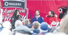  ?? BOB TYMCZYSZYN/POSTMEDIA FILE PHOTO ?? Rogers Hometown Hockey co-host Tara Stone speaks with former National Hockey League players Shayne Corson and Darcy Tucker when the tour came through downtown St. Catharines in December 2014.