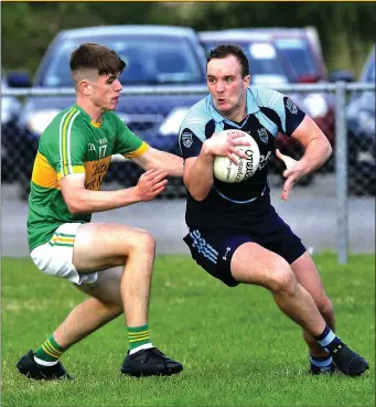  ??  ?? Cian Surlis of Tourlestra­ne tries to intercept Tom Kelly of St Johns at Curry last Saturday in the opening round of Senior Championsh­ip games.