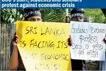  ?? ?? On Friday, academics and staff members of the University of Colombo held a silent protest on the current economic situation including the power cuts which have caused hardships to the people. Students too. joined the protest campaign. Pic by Indika Handuwala