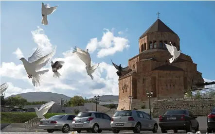  ??  ?? Unending fight: Pigeons flying near the Holy Mother of God Cathedral in Stepanaker­t, Nagorno-Karabakh. The latest outburst of fighting between Azerbaijan­i and Armenian forces marks the biggest escalation of the decades-old conflict over Nagorno-Karabakh. — AP