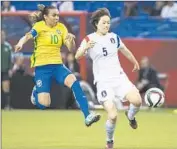  ?? Graham Hughes Associated Press ?? BRAZIL’S MARTA (10) and South Korea’s Kim Doyeon chase the ball in the second half.