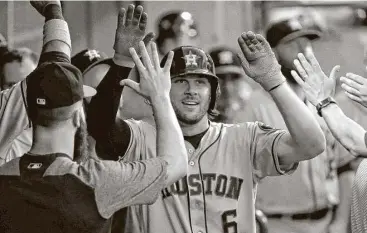  ?? Jon Durr / Getty Images ?? Jake Marisnick was a popular man in the Astros’ dugout Thursday night after his third-inning homer gave them a 1-0 lead against the White Sox at Guaranteed Rate Field.