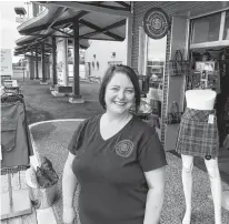  ?? NICOLE SULLIVAN • CAPE BRETON POST ?? Deana Lloy stands outside her newly opened retail store, Red Label Kilts, located at the Joan Harriss Cruise Pavilion on the Sydney waterfront. Along with goods like purses, haggis and tartan jewelry, the shop has a tartan design station for clients to consult with Lloy.