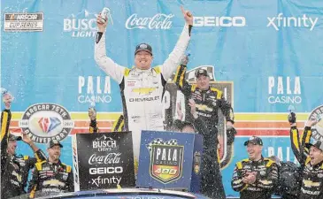  ?? Meg Oliphant/Getty Images ?? Kyle Busch celebrates in victory lane after winning the NASCAR Cup Series Pala Casino 400 at Auto Club Speedway on Sunday in Fontana, California.