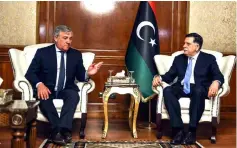  ??  ?? Tajani (left) meets with Libya’s unity government Prime Minister Fayez al-Sarraj at his office in the capital Tripoli. — AFP photo