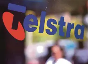  ?? REUTERS PIC ?? Telstra plans to axe a quarter of its staff by splitting its mobile and infrastruc­ture divisions into separate entities.
