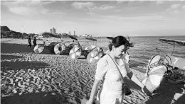  ?? GIULIA MARCHI/THE NEW YORK TIMES ?? A beach in Xingcheng, China. The small town boasts 1,200 swimwear manufactur­ers.