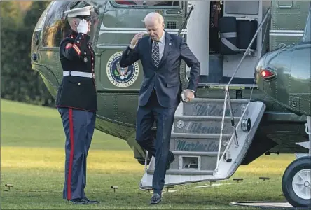  ?? Andrew Harnik Associated Press ?? PRESIDENT BIDEN returns to the White House on Thursday after traveling to Philadelph­ia, where he presented his budget proposal — a plan that would raise taxes on wealthy Americans and corporatio­ns, increase spending on social programs and trim the federal deficit.