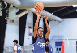  ?? ?? Carlos Adamson Jr. shoots during drills at a Grind Prep basketball practice at the Oklahoma Athletic Center.