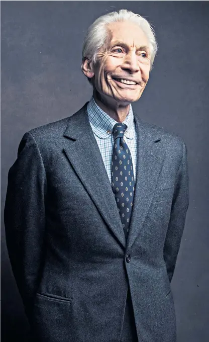  ??  ?? Charlie Watts, smartly attired as ever, poses for a portrait in New York in 2016.