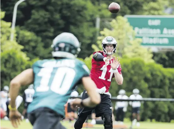  ?? THE ASSOCIATED PRESS ?? Eagles QB Carson Wentz is wearing the “don’t-hit-me” red jersey in training camp until he’s cleared for contact by medical staff.