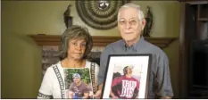  ??  ?? Elena and Chuck Nunemacher, mother and father of Joe Nunemacher, pose with cherished photos of their son in the living room of their home in Westmorlan­d on Oct. 25. VINCENT OSUNA PHOTO