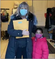  ?? SUBMITTED PHOTO ?? Lorin Richter, left, president of Lower Providence Optimist Club, and Aahana Gupta, who created and submitted 33 Valentine’s Day cards for the club’s latest project.