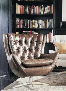  ?? POTTERY BARN ?? With a nod to mid-century modern style, the Wells swivel chair from Pottery Barn incorporat­es classic detailing.