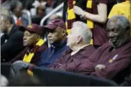  ?? DAVID GOLDMAN — THE ASSOCIATED PRESS ?? Loyola-Chicago team members from 1963, Jerry Harkness, Les Hunter, John Egan, Rich Rochelle, from left, watch action during the second half of a regional semifinal game, between Loyola-Chicago and Nevada, in Atlanta.