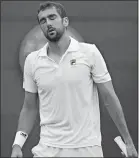  ?? KIRSTY WIGGLESWOR­TH/AP PHOTO ?? Marin Cilic loses a point to Guido Pella during their men’s singles match on Thursday at Wimbledon in London.