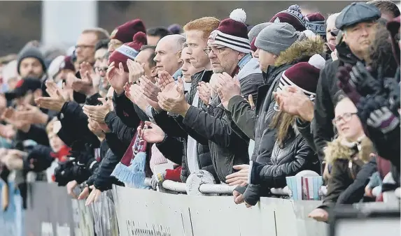  ??  ?? South Shields fans, who have been sent gifts and messages of hope from the club during the pandemic.