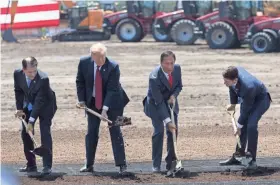  ?? MARK HOFFMAN / MILWAUKEE JOURNAL SENTINEL ?? President Trump (second from left) is joined by Gov. Scott Walker (left), Foxconn Chairman Terry Gou and House Speaker Paul Ryan (right) June 28 during the ceremonial groundbrea­king for Foxconn’s factory in Mount Pleasant. The Taiwanese-based firm has...