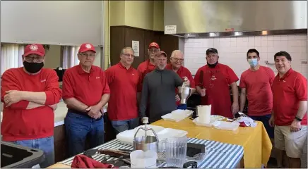  ?? KEVIN MARTIN — THE MORNING JOURNAL ?? Members of the Lorain Lions Club pose while serving pancake breakfasts May 2at the Italian Veterans Club, as part of fundraisin­g efforts in support of a 4-year-old girl to help buy a hearing transmitte­r.