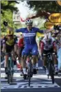  ?? CHRISTOPHE ENA — AP ?? Italy’s Elia Viviani celebrates as he crosses the finish line to win the fourth stage of the Tour de France cycling race over 214 kilometers (133 miles) with start in Reims and finish in Nancy, France, Tuesday.