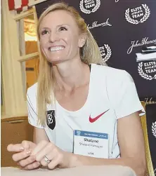  ?? STAFF PHOTO BY FAITH NINIVAGGI ?? LAST HURRAH: Shalane Flanagan, shown speaking to the media on Friday, will run the Boston Marathon for the fourth and final time tomorrow.