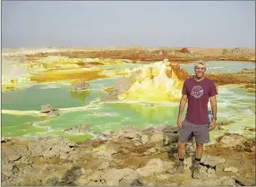  ?? COURTESY PHOTOS ?? Above: Colton Flynn is standing at the Danakil Depression in Ethiopia, one of the hottest, driest and lowest places on the planet. The colors come from the sulfur that is bubbling up from the volcanic activity undergroun­d. Similar to Yellowston­e, Flynn...