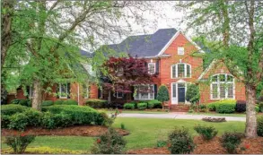  ?? PHOTOS BY LINDA GARNER-BUNCH/Arkansas Democrat-Gazette ?? Perfect for entertaini­ng on a grand scale, as well as everyday family life, this Conway home offers four bedrooms, four full and two half baths, four living areas, a swimming pool and more.