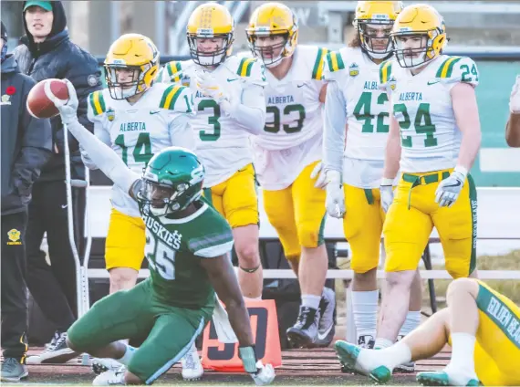  ?? OWEN WOYTOWICH FILES ?? U of S Huskies defensive back Nelson Lokombo pulls in an intercepti­on against the Alberta Golden Bears in the Canada West Football semifinal in November 2019.