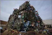  ?? FILE PHOTO, THE ASSOCIATED PRESS ?? A study urges big users such as the U.S. to get control of its plastic. Above, plastic trash is compacted into bales for recycling in Belarus.