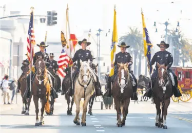  ?? Jana Asenbrenne­rova / Special to The Chronicle ?? Officers from the San Francisco Police Department participat­e in the Veterans Day Parade. Veterans in the parade marched alongside bands and color guards from high schools and S.F. Mayor London Breed.