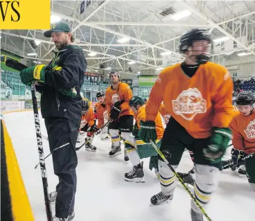  ?? LIAM RICHARDS / SASKATOON STARPHOENI­X ?? The Broncos hit the ice with head coach Nathan Oystrick in late August during the first day of training camp at Elgar Petersen Arena in Humboldt, Sask. The team’s Wednesday-night home opener will be broadcast nationwide by TSN.