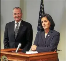  ?? GREGG SLABODA — THE TRENTONIAN ?? Assemblywo­man Liz Muoio (right) answers questions after she was nominated by Gov.-elect Phil Murphy for state treasurer.