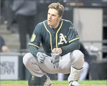  ?? PHOTOS: NAM Y. HUH — THE ASSOCIATED PRESS ?? A’s outfielder Mark Canha reacts after striking out on a foul tip during the sixth inning of Friday’s second game.