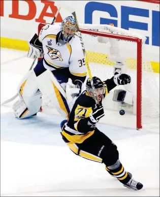  ?? ASSOCIATED PRESS ?? PITTSBURGH PENGUINS’ EVGENI MALKIN (71) CELEBRATES HIS GOAL against Nashville Predators goalie Pekka Rinne (35) during the third period in Game 2 of the Stanley Cup Final on Wednesday in Pittsburgh.