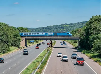  ?? JACK BOSKETT ?? Locomotive Services Limited's ‘Midland Pullman' High Speed Train, comprising Class 43 power cars Nos. 43055 and 43046, crosses the M5 at Haresfield, Gloucester­shire, with the 5Z14 empty stock move from Bristol Parkway to Crewe carriage sidings on June 13. Fully booked are the Midland Pullman's ‘Heart of Wales' excursion from Preston to Cardiff on Saturday, July 17, the ‘Settle & Carlisle Jorvik Pullman' on Saturday, August 14, the ‘Settle & Carlisle Pullman' from St Pancras on Saturday, August 21, and the ‘Devonian Pullman' from Peterborou­gh to Kingswear on Monday, August 30.