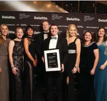  ??  ?? Niall Murray, Managing Director of Collins McNicholas, with some of the team celebratin­g at the awards ceremony.