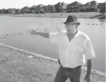  ?? DAX MELMER ?? Lloyd Crain, president of the board of directors for Southwood Lakes townhouses, says residents aren’t allowed to feed geese, but some people come to the subdivisio­n’s small lakes to provide food for the fowl.