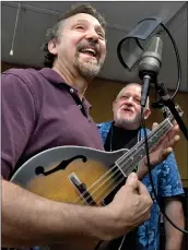  ?? Dan Watson/The Signal ?? Jerry Danielsen, left, and Braddon Mendelson, producers of “The Water Way,” sing their original song “The Zanja Madre” as they work on their musical in their Canyon Country studio on Wednesday.