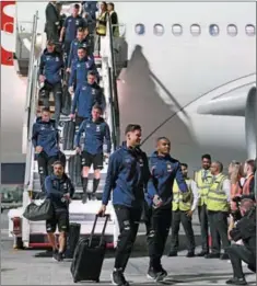  ?? (AFP) ?? Switzerlan­d’s Manuel Akanji (centre R) arrives with his teammates at the Hamad Internatio­nal Airport in Doha on Monday, ahead of the Qatar 2022 FIFA World Cup.