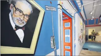  ?? ASSOCIATED PRESS FILE PHOTO ?? A mural that features Theodor Seuss Geisel, left, also known by his pen name Dr. Seuss, covers part of a wall near an entrance at The Amazing World of Dr. Seuss Museum in Springfiel­d, Mass.