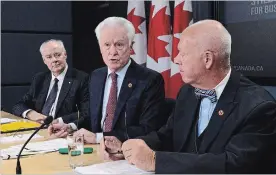  ?? SEAN KILPATRICK THE CANADIAN PRESS ?? Senate Committee on Banking, Trade and Commerce members Senator Jean-Guy Dagenais, Deputy Chair of the committee, right to left, Senator Doug Black, Q.C., Chair of the committee, and Perrin Beatty, P.C., President and CEO, Canadian Chamber of Commerce speak during a Press Conference at the National Press Theatre in Ottawa on Tuesday.