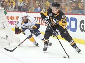  ?? CHARLES LECLAIRE, USA TODAY SPORTS ?? Jake Guentzel, right, scored in the Penguins’ 5-3 victory in Game 1, ending his eightgame goal drought.