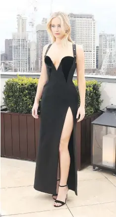  ?? WENN.COM ?? “That Versace dress was fabulous,” Jennifer Lawrence said to critics of her photo call outfit. “Everything you see me wear is my choice.”