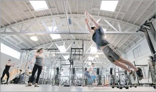  ?? Photograph­s by Luis Sinco Los Angeles Times ?? ECHO PARK’S new Pharos is designed to be a welcoming, light-filled gym for beginners and exercise buffs alike. Its owners aim to make it a neighborho­od hangout.